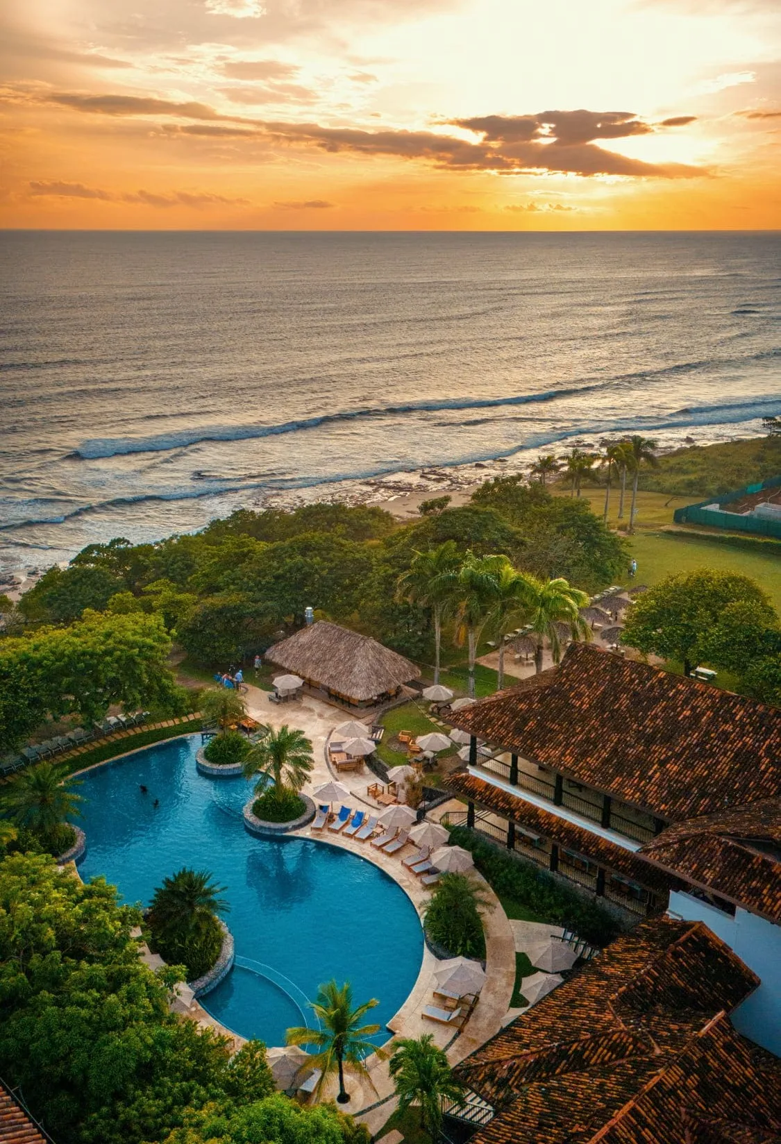 Sunset ocean and pool view at Hacienda Pinilla