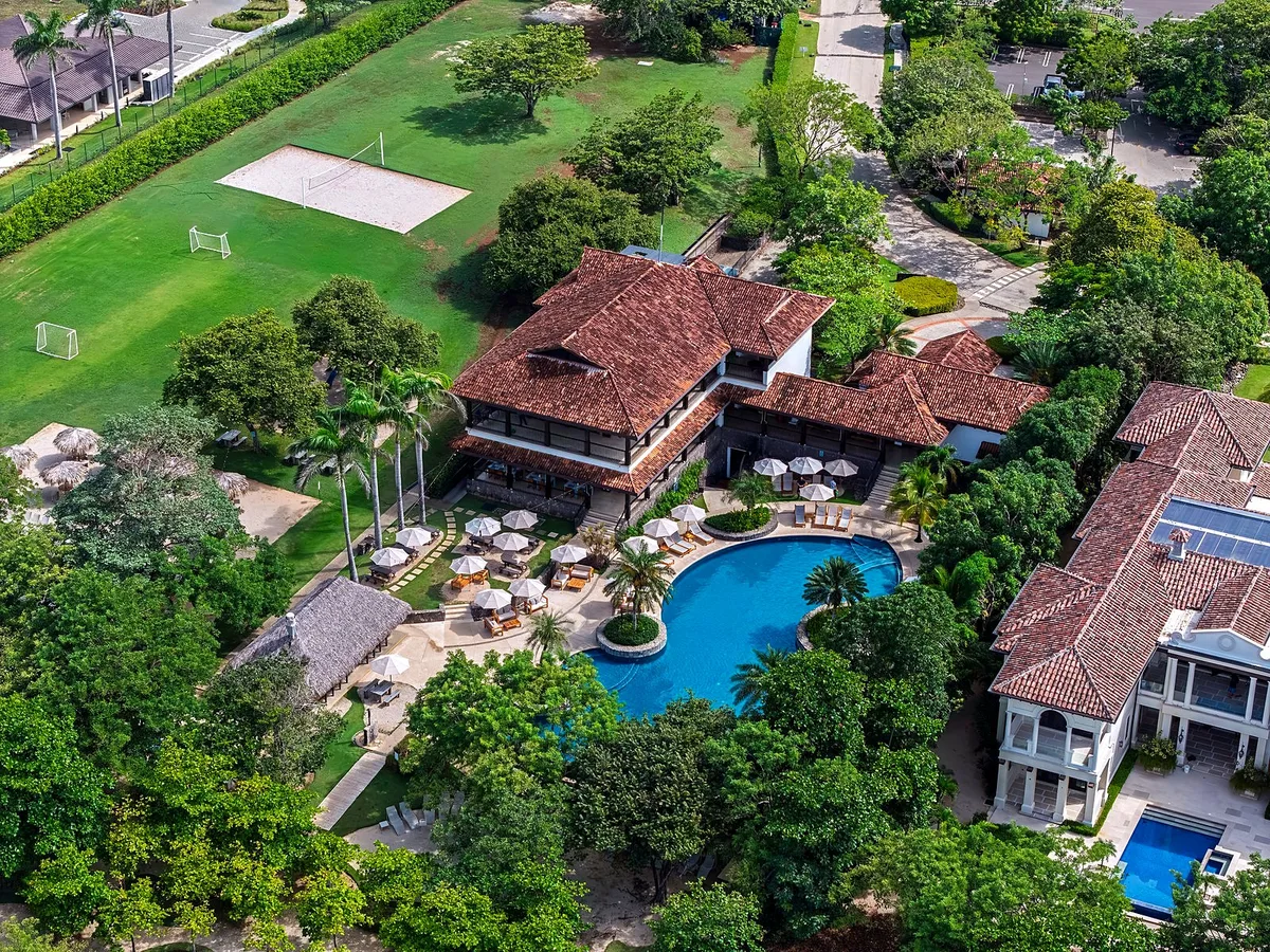 Aerial view of a Hacienda Pinilla residential area with homes, pool and resort amenities